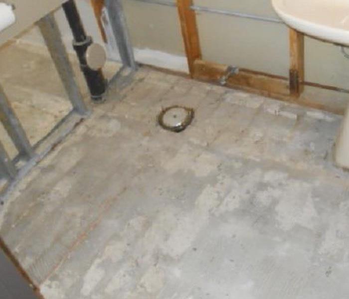 bathroom with concrete floor exposed and wood and metal framing exposed