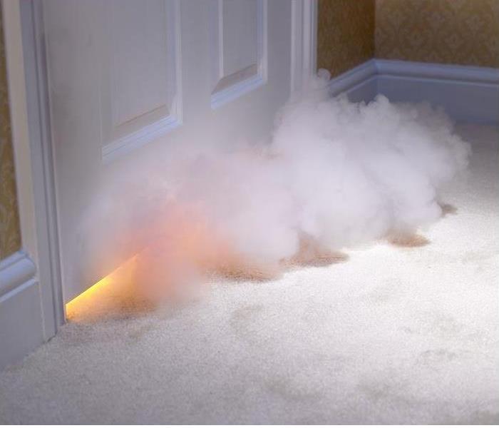 smoke entering room from under door