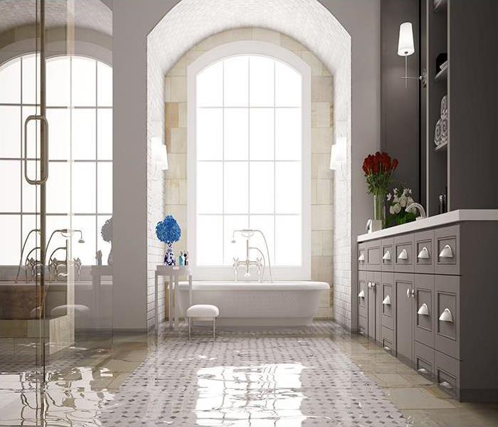 large bathroom with tile floor covered in water
