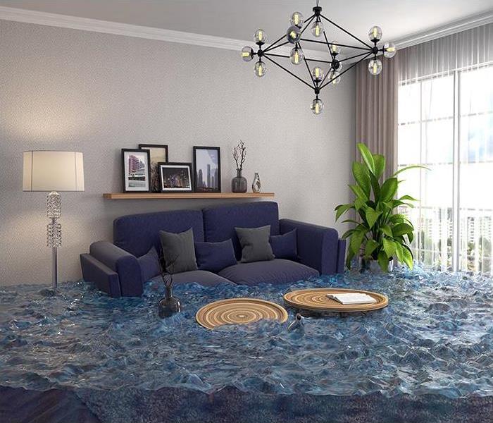 living room with a blue couch flooded with water