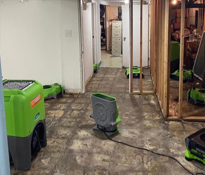 A basement with SERVPRO equipment through out. 