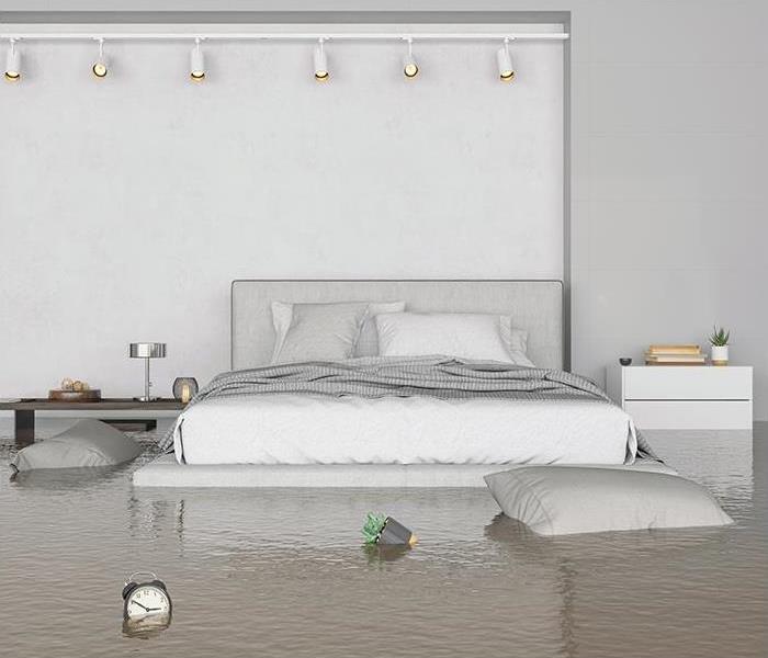 bedroom with white walls and bed, flooded